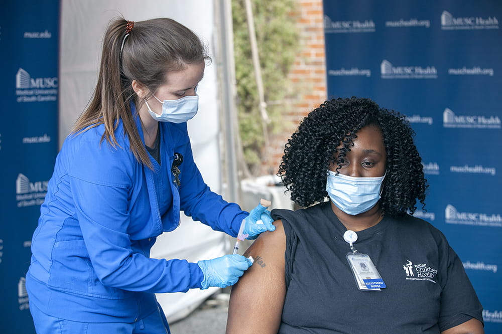 Shemika Champion becomes first person at MUSC Health to get COVID-19 vaccine.