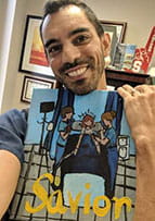 Dr. Ramin Eskandari holds painting made by a former patient.