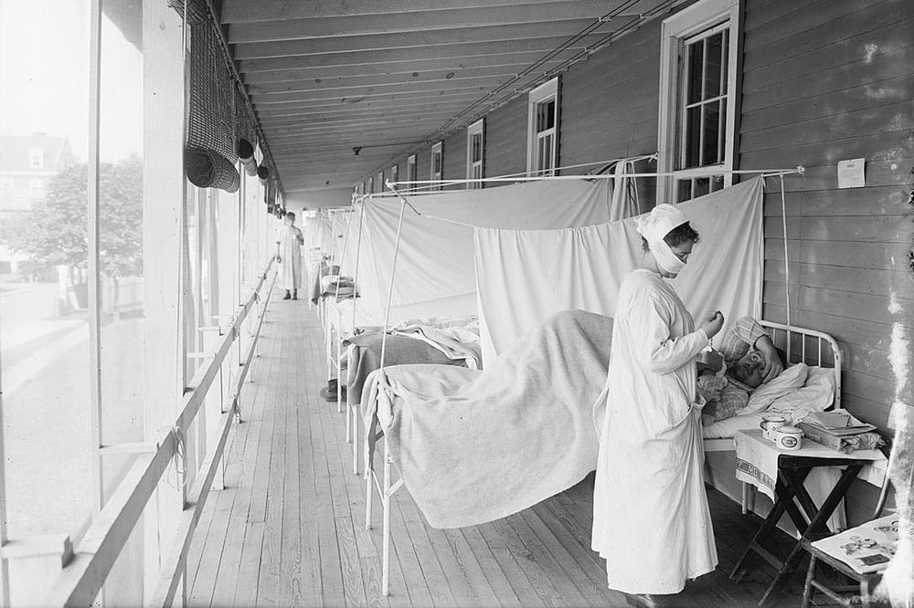 Nurse works during 1918 flu pandemic.