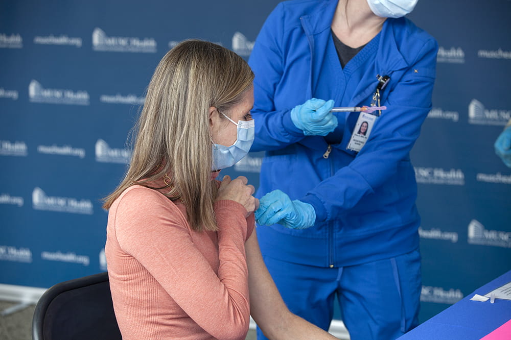 Dr. Danielle Scheurer gets COVID-19 vaccine.