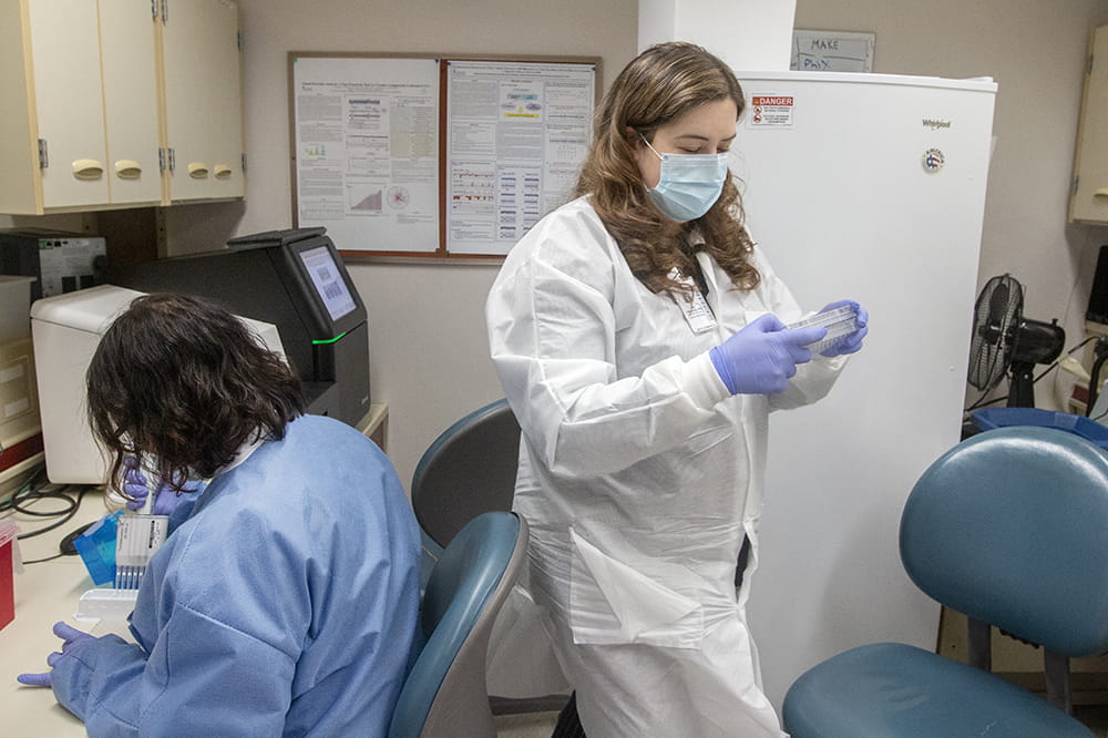 Medical technologist Kristen Maurer, left, and Dr. Julie Hirschhorn prepare samples for sequencing.