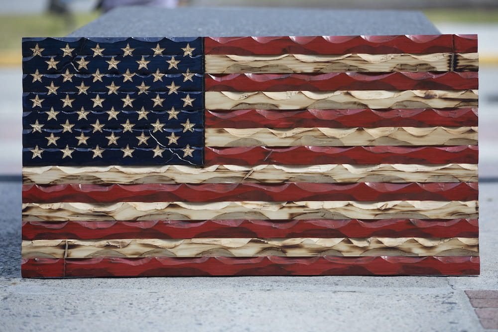 Close up of hand carved American flag in red, white and blue