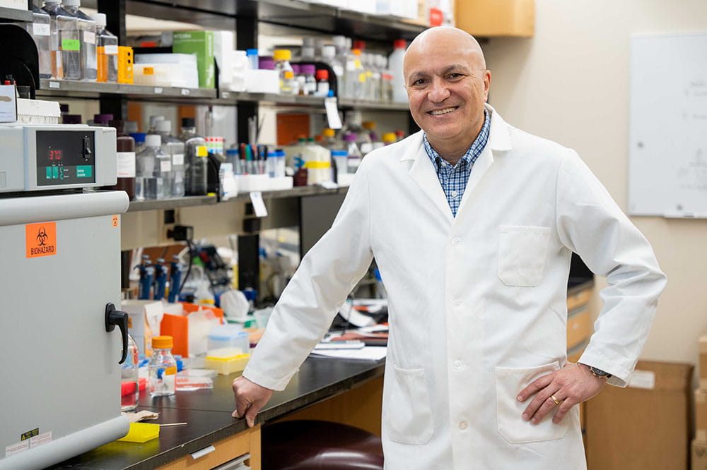 Dr. Besim Ogretmen stands in his lab