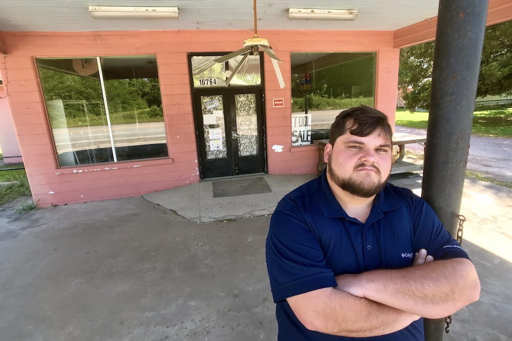 Casey Chubb standing in front of his mother's old thrift store