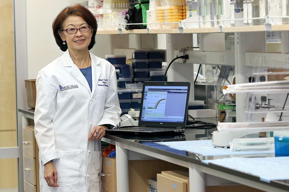 Dr. Tsao standing in lab.