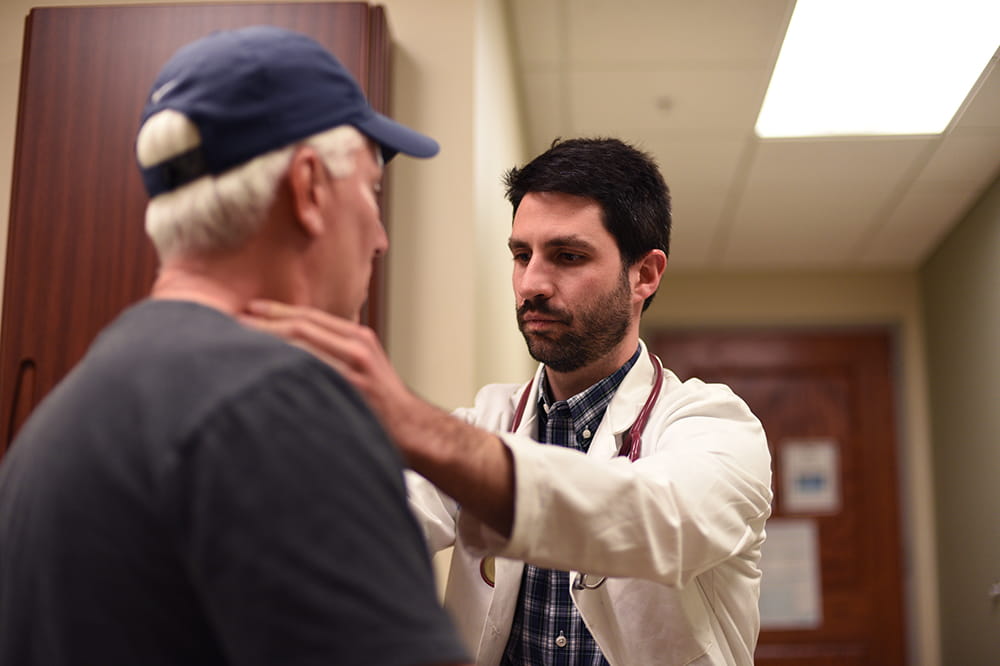 Dr. Brian Hess with a patient