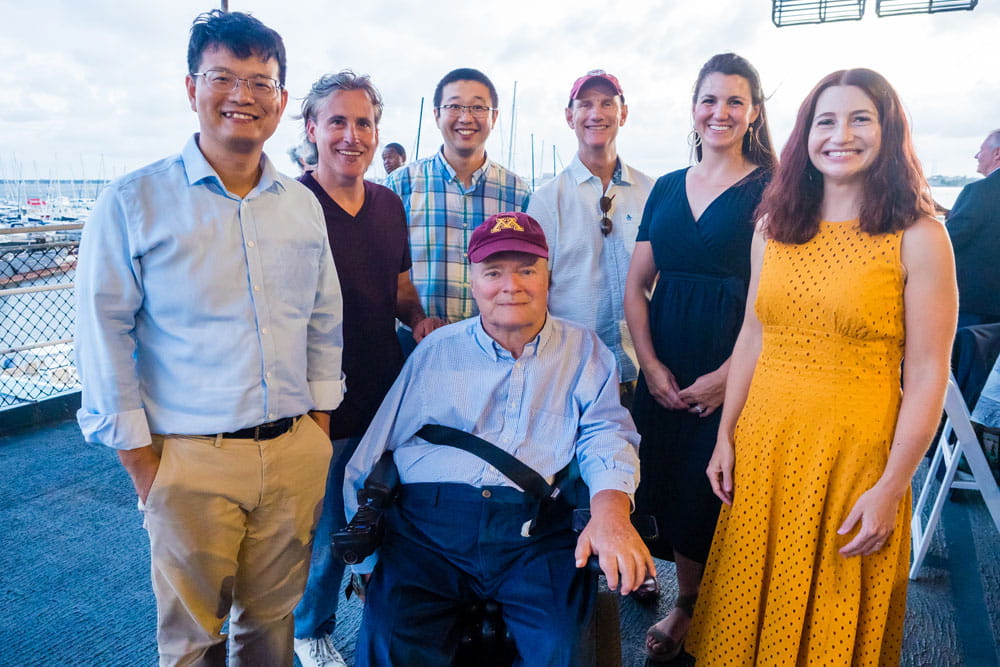 James Krause, Ph.D. (center) and his team gathered together on a rooftop.