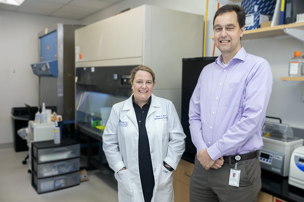 Dr. Lauren Ball (left) and Dr. Eric Meissner (right) in the proteomics facility.