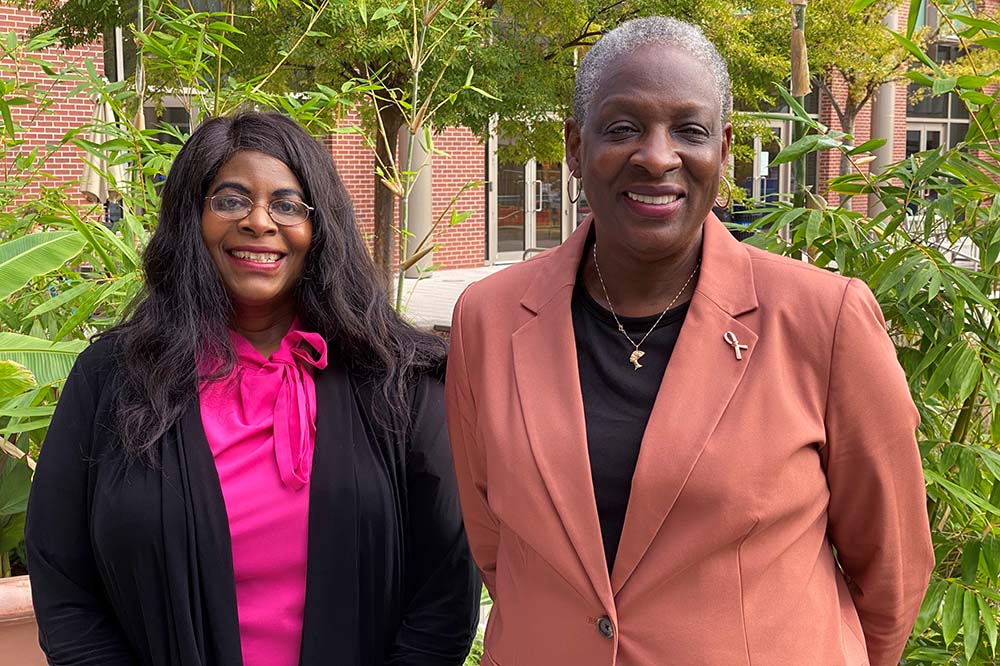 Dr. Marvella Ford and Melanie Slan stand outside