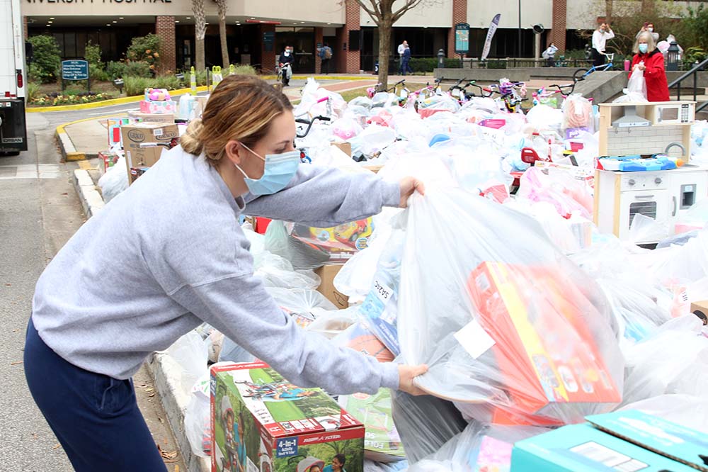 MUSC pharmacy resident Amelia Slane drops off bags of gifts for the Salvation Army's Angel Tree program.