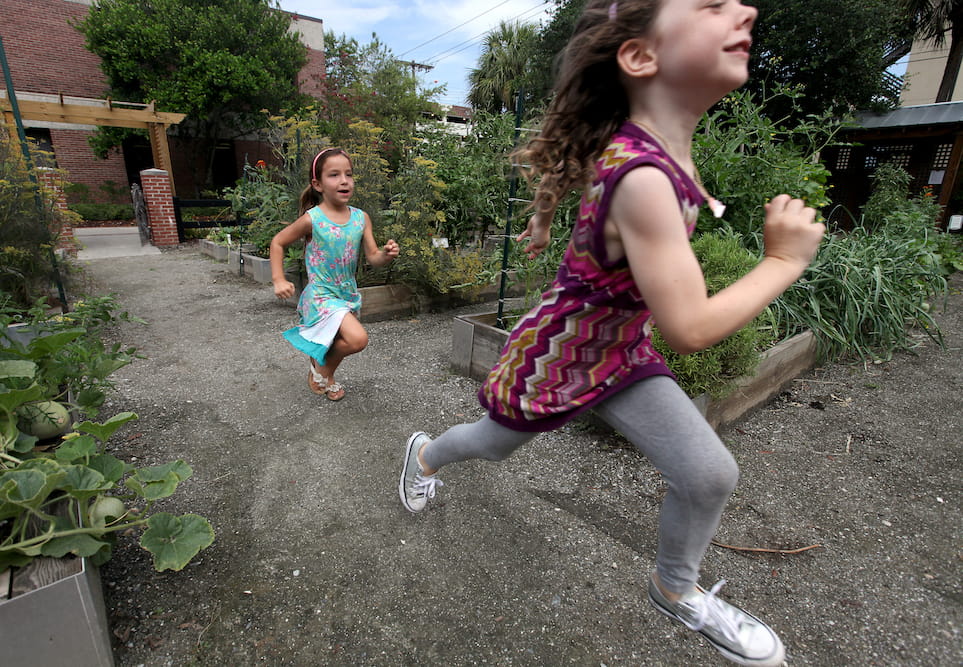 Children playing in the MUSC urban garden. Photograph by Sarah Pack.