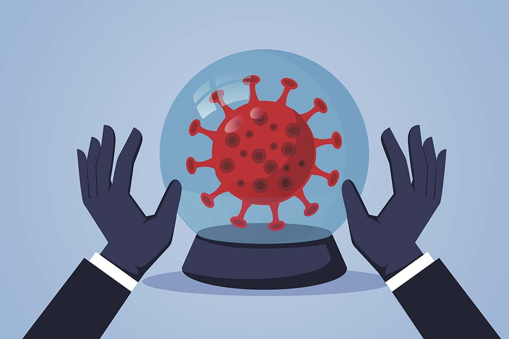 Hands surround a crystal ball that contains the coronavirus.