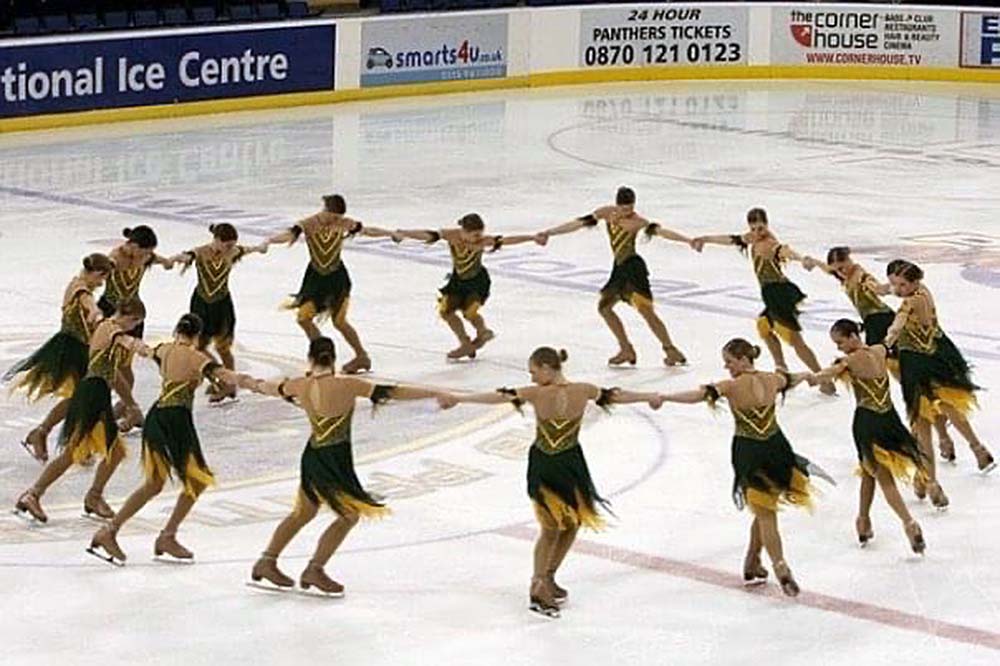 Colleen Donahue and fellow synchronized skaters form a circle. 
