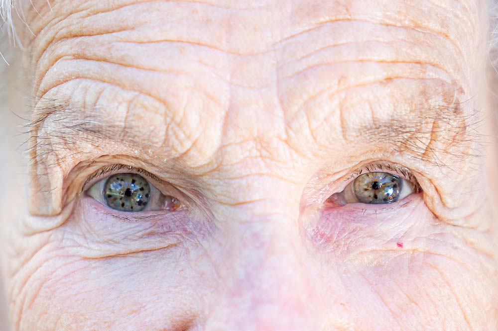 Closeup of an elderly woman's blue eyes. iStock