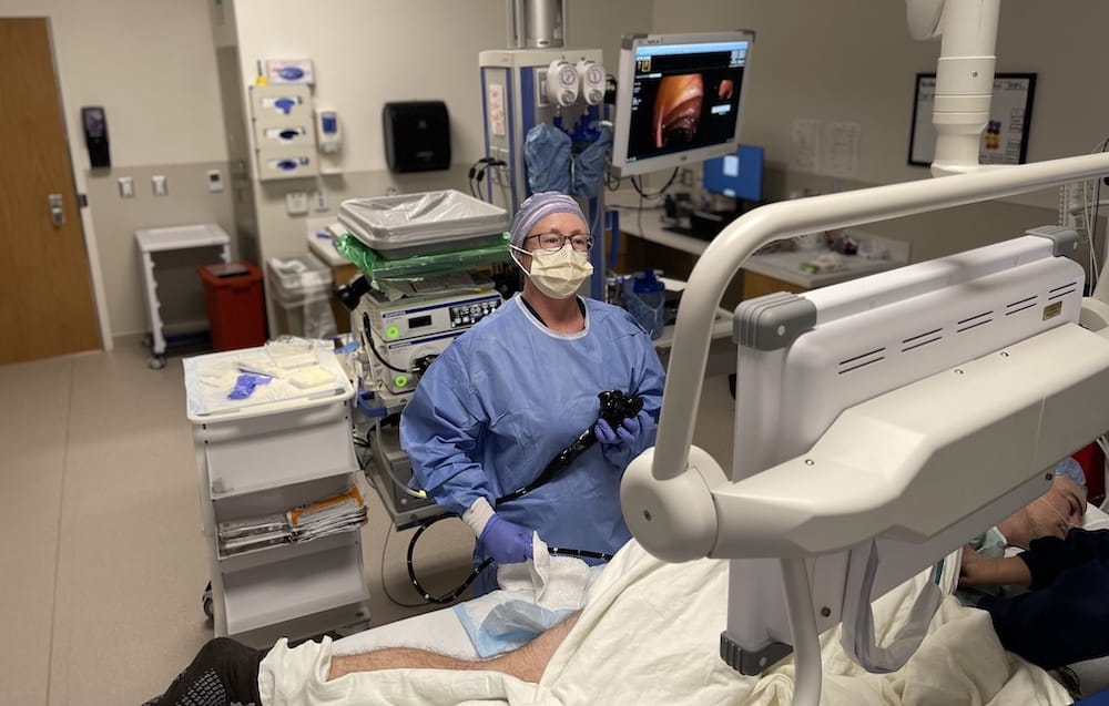 view inside the operating room of surgeon performing colonoscopy