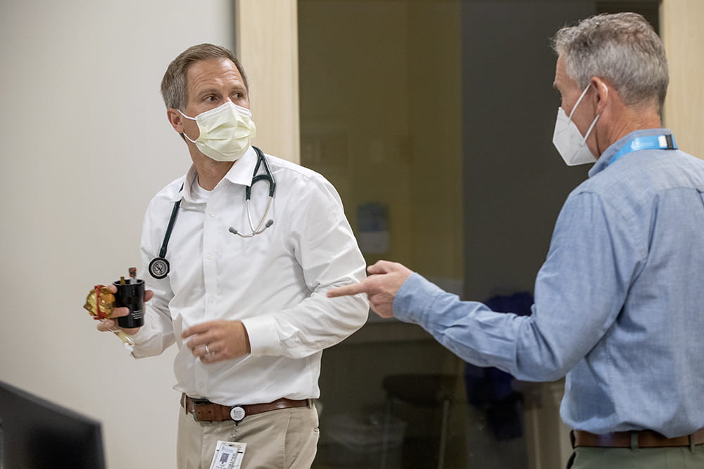 Ronald Teufel, II, M.D. (left) in conversation with Andrew Atz, M.D. (right)