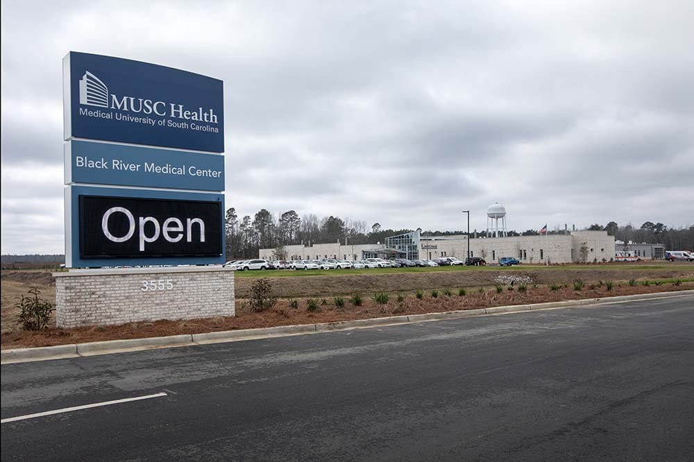 Sign saying MUSC Health Black River Medical Center is open.