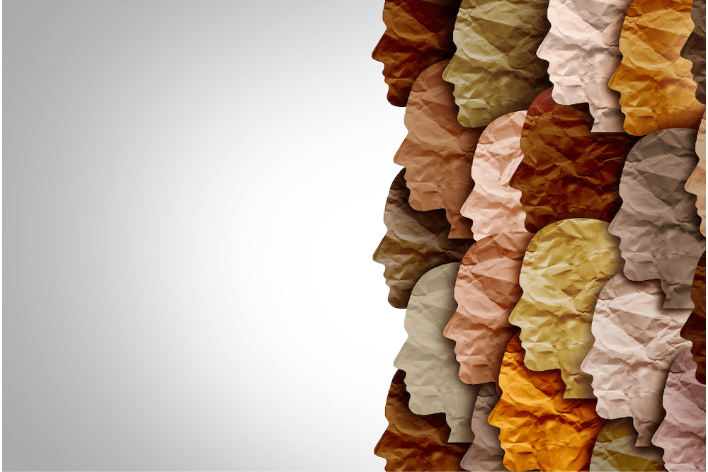 Diverse faces made out of paper facing right. wildpixel via Canva.com