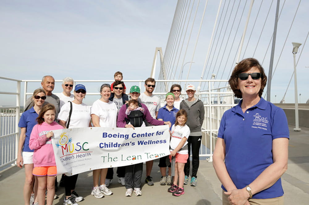 Dr. Janice Key poses The Lean Team on the then new Ravenel Bridge