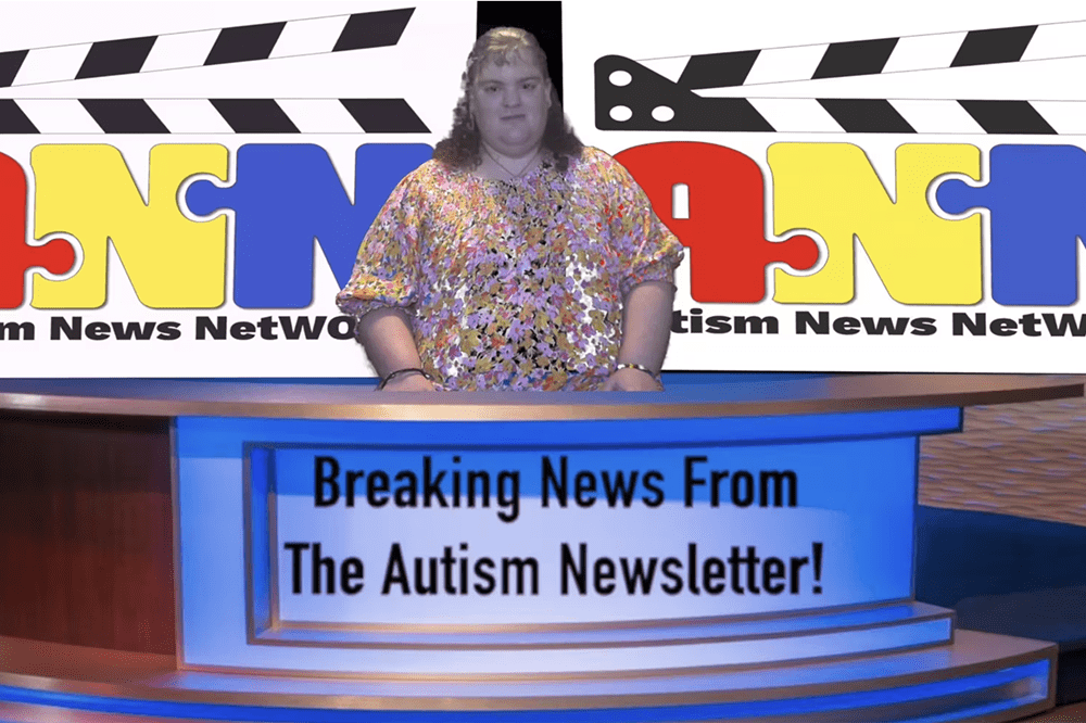 Woman in a dress stands at a news desk with the words Breaking News From the Autism Newsletter on it.