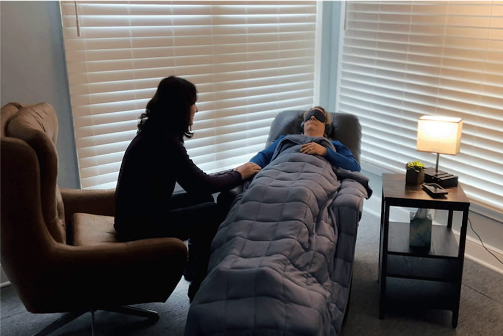 Dr. Jennifer Jones (left) and Melissa Michel (right, reclining), lead therapist for MUSC's Centerspace clinic, demonstrating psychedelic-assisted therapy