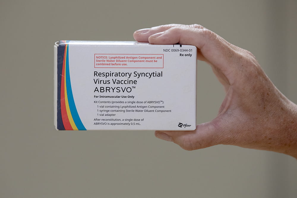 Hand holding box that says respiratory syncytial virus vaccine ABRYSVO.