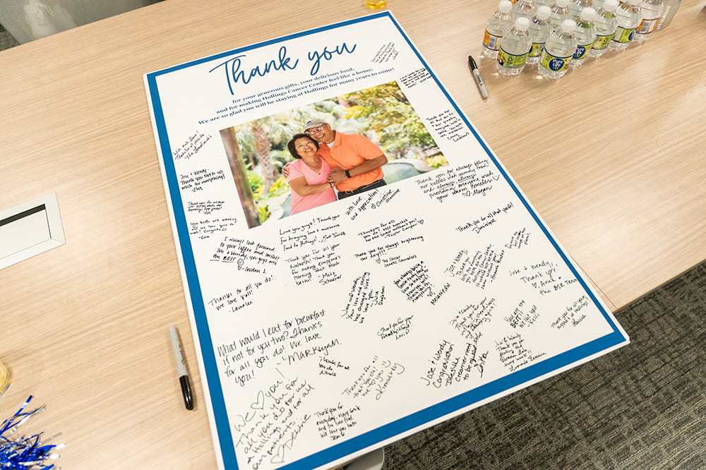 a signed poster thanking Jose and Wendy for all they do at Hollings Cafe