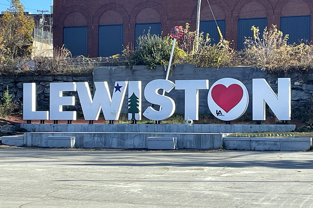 White letters spelling Lewiston. There's a heart in the letter O.