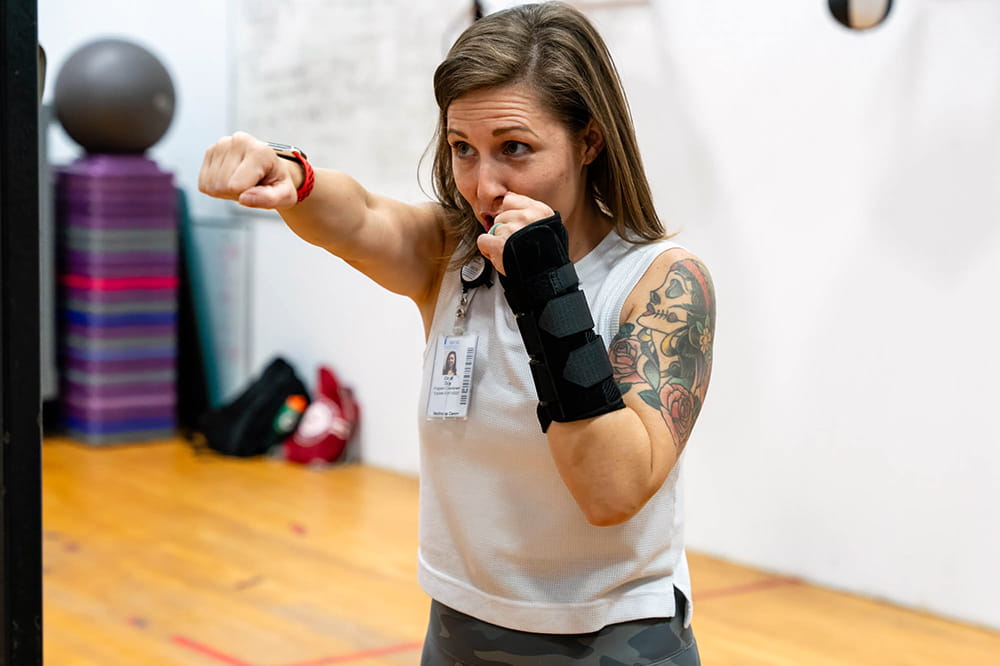 an MUSC Wellness Center instructor shows how to throw a punch