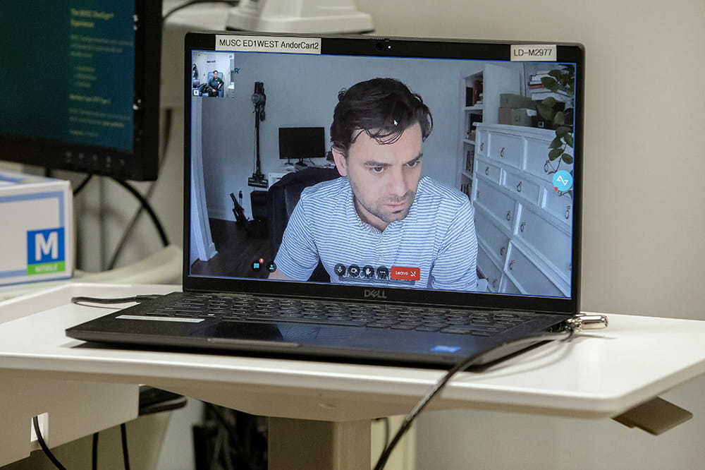 Desktop computer showing a man looking to the side.