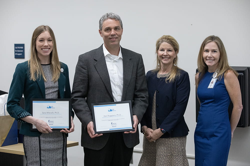 Blue Sky Award winners Kenneth Ruggiero, Ph.D., and Sarah Witcraft, Ph,D, with VIce President for Research Dr. Lori McMahon and Chief Innovation Officer Dr. Jesse Goodwin,