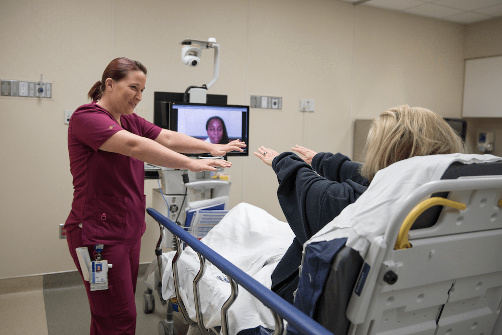  Telestroke demonstration. Nurse Jessica Hewitt (on left), MUSC Health provider Dr. Carlene Kingston (on screen) and nurse Perette Sabatino ( on stretcher).