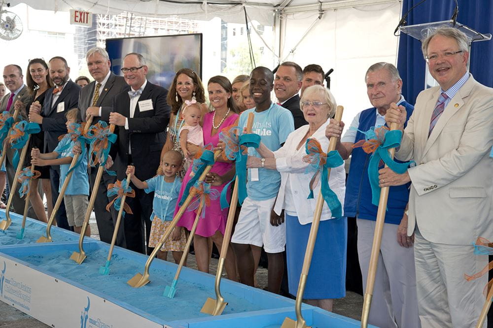 The Tourvilles, second and third from right, join former Charleston mayor John Tecklenberg, the Shawn Jenkins family, MUSC leaders and guests at the groundbreaking. 