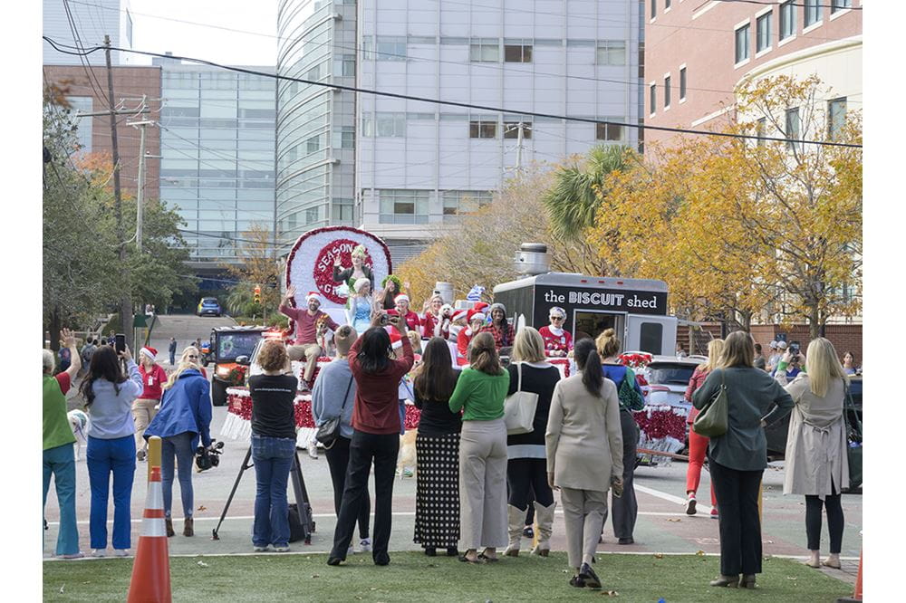 Parade floats and vehicles traveled down Courtney Drive and ended at the Medical District Greenway where employees and spectators gathered to unload toys and gifts. 