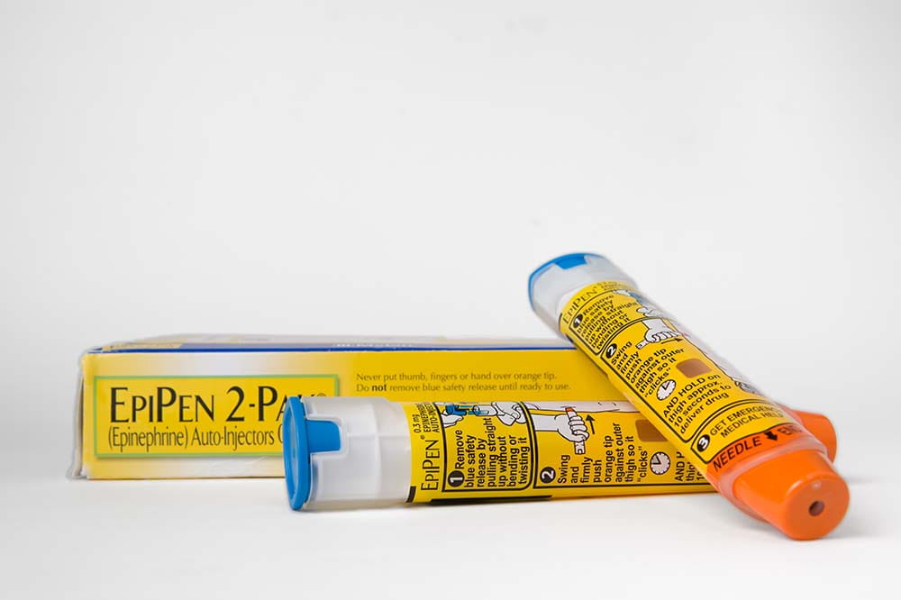 Package with two tubes. They are yellow with dark writing and say EpiPen 2-pak.