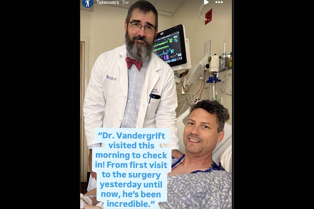 A bearded man in a doctor's coat stands at the bedside of a reclining man who has curly hair. A note on the photo says Dr. Vandergrift visited this morning to check in! From the first visit to the surgery yesterday until now, he's been incredible.