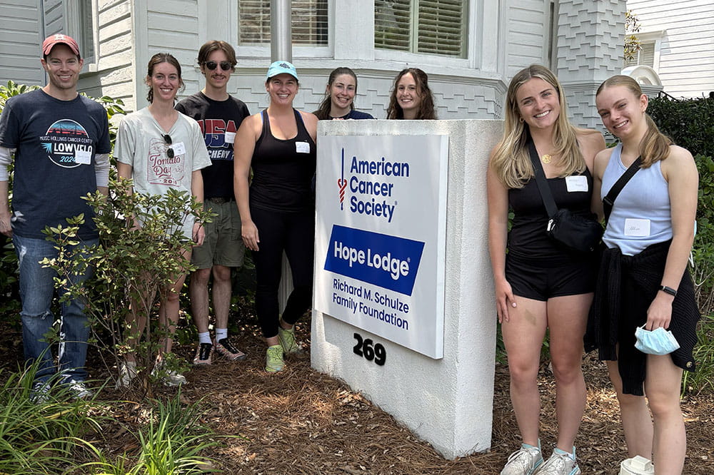 group photo of graduate students in front of Hope Lodge
