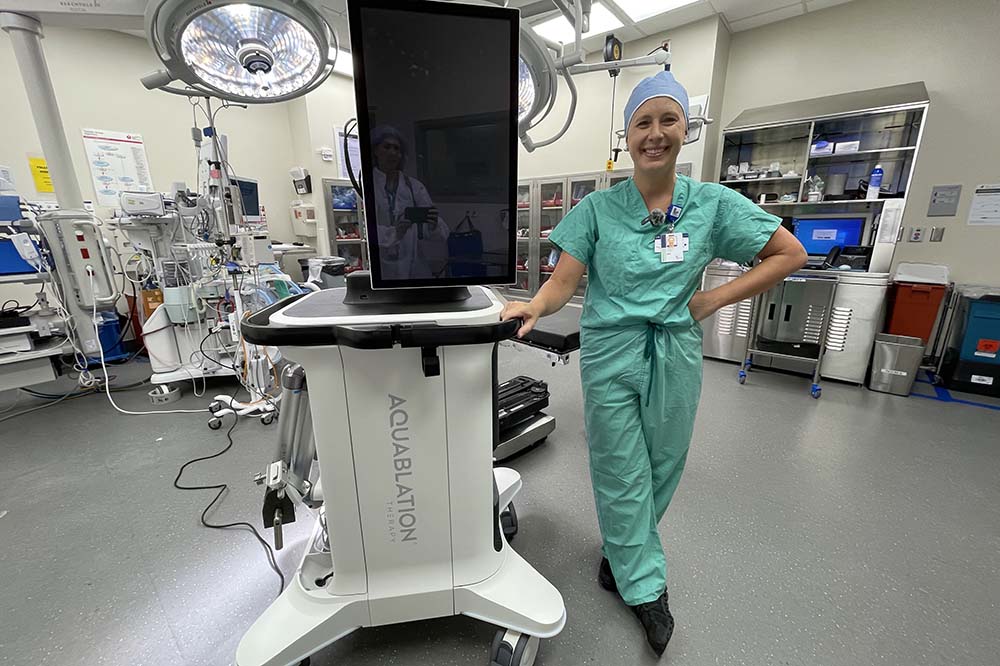 Woman in green scrubs in an operating room